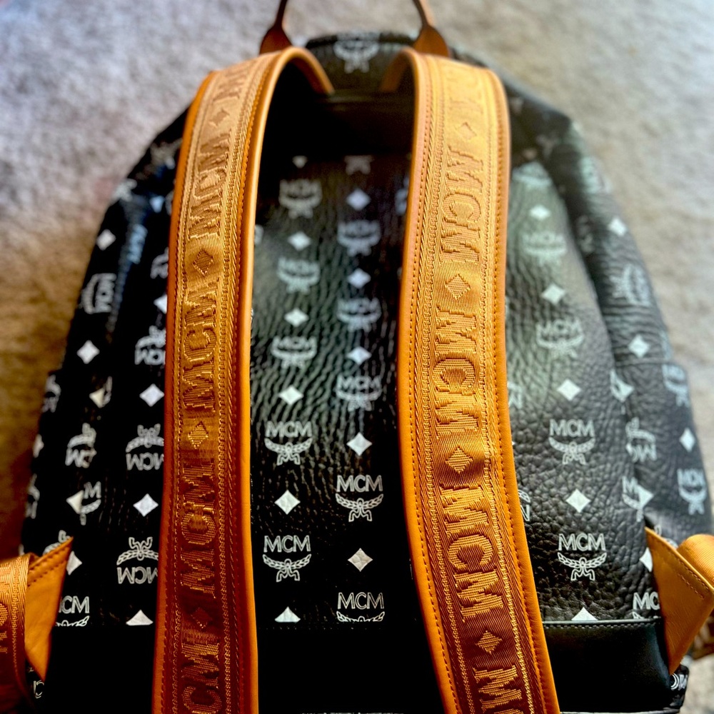 Black,white, tan. Full size backpack and has cool design.